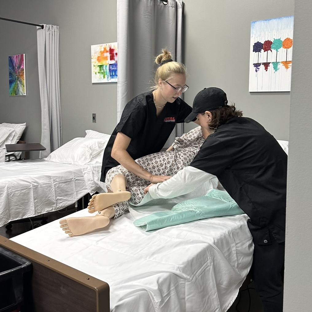 Two healthcare professionals with a patient